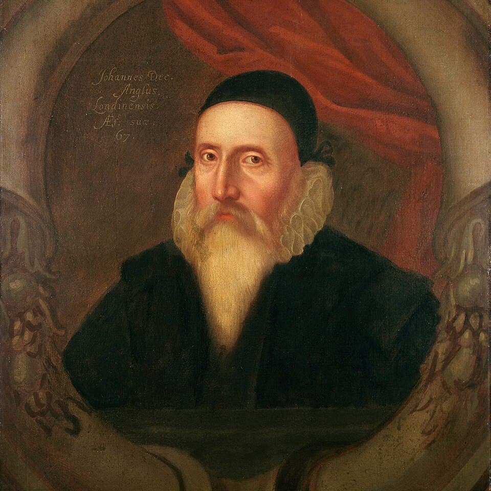 A painted portrait of John Dee as an old man with a long white beard, black cap and white ruff